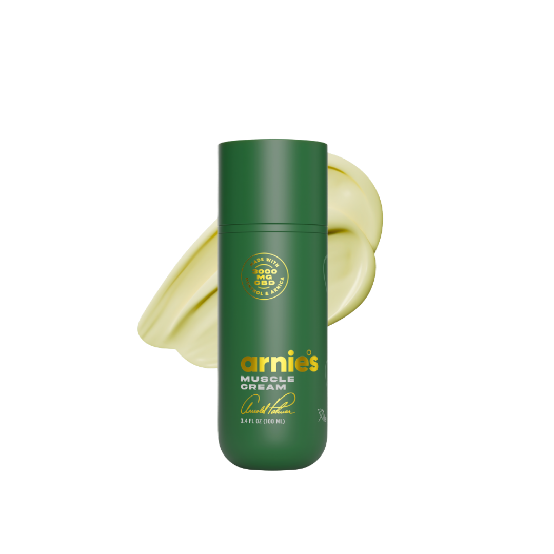 Green bottle of Arnies Muscle Cream with a yellow circular design on a white background