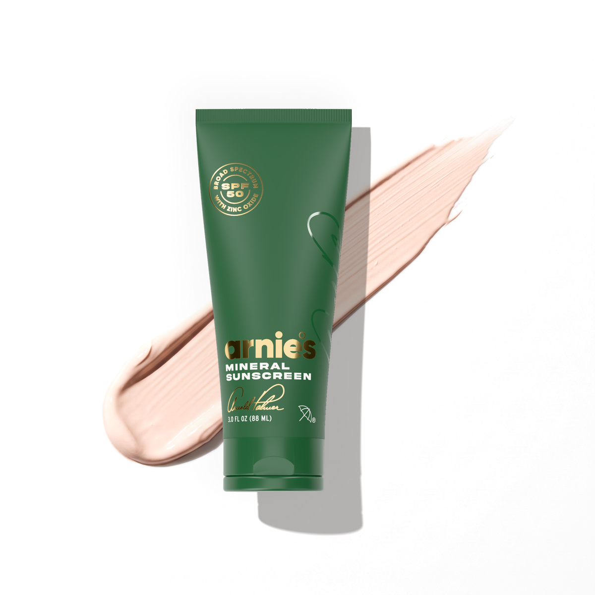 Arnie's Mineral Face Sunscreen tube over a swipe of the pale blush-tinted lotion.